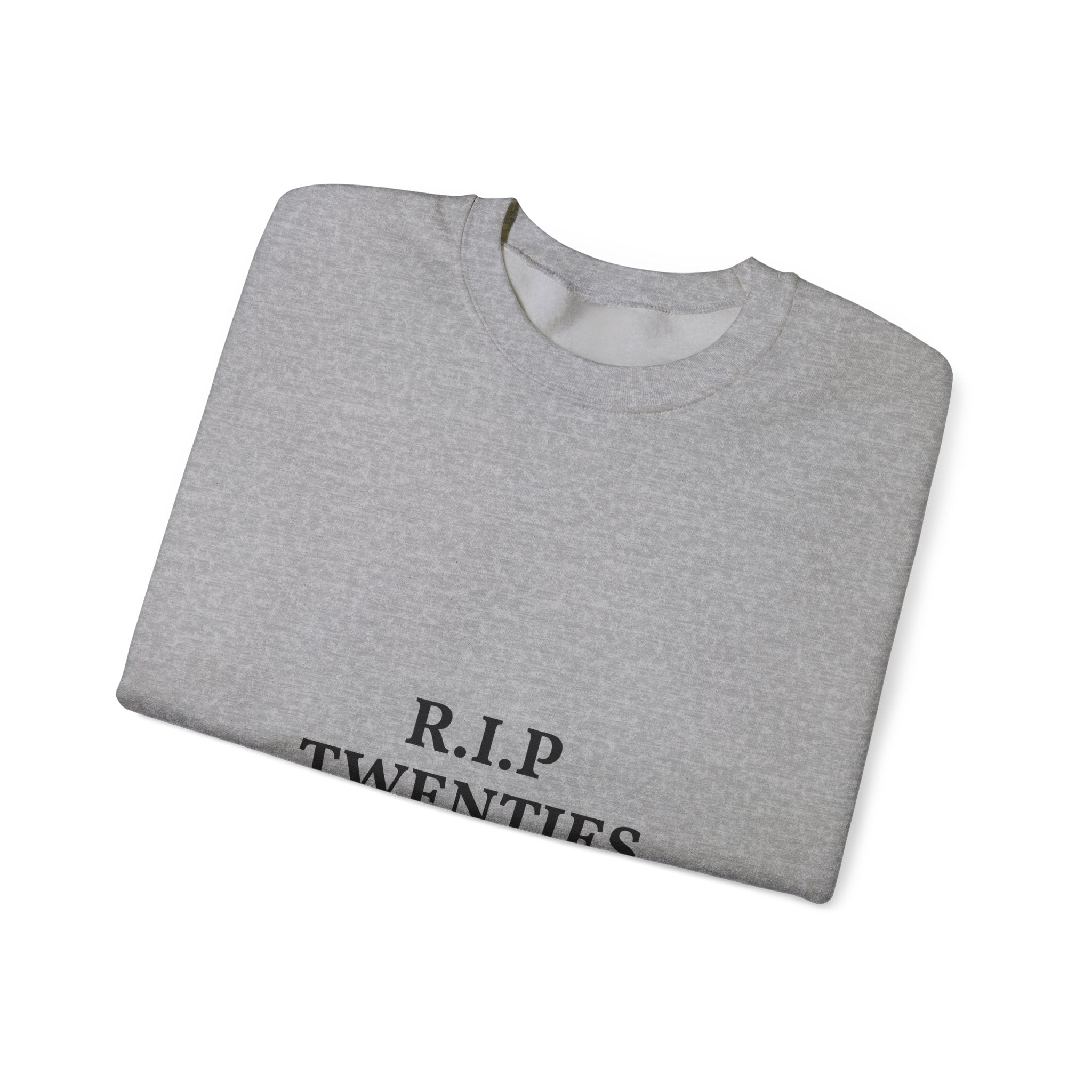 Folded gray sweatshirt with 'R.I.P. TWENTIES' text on a white background