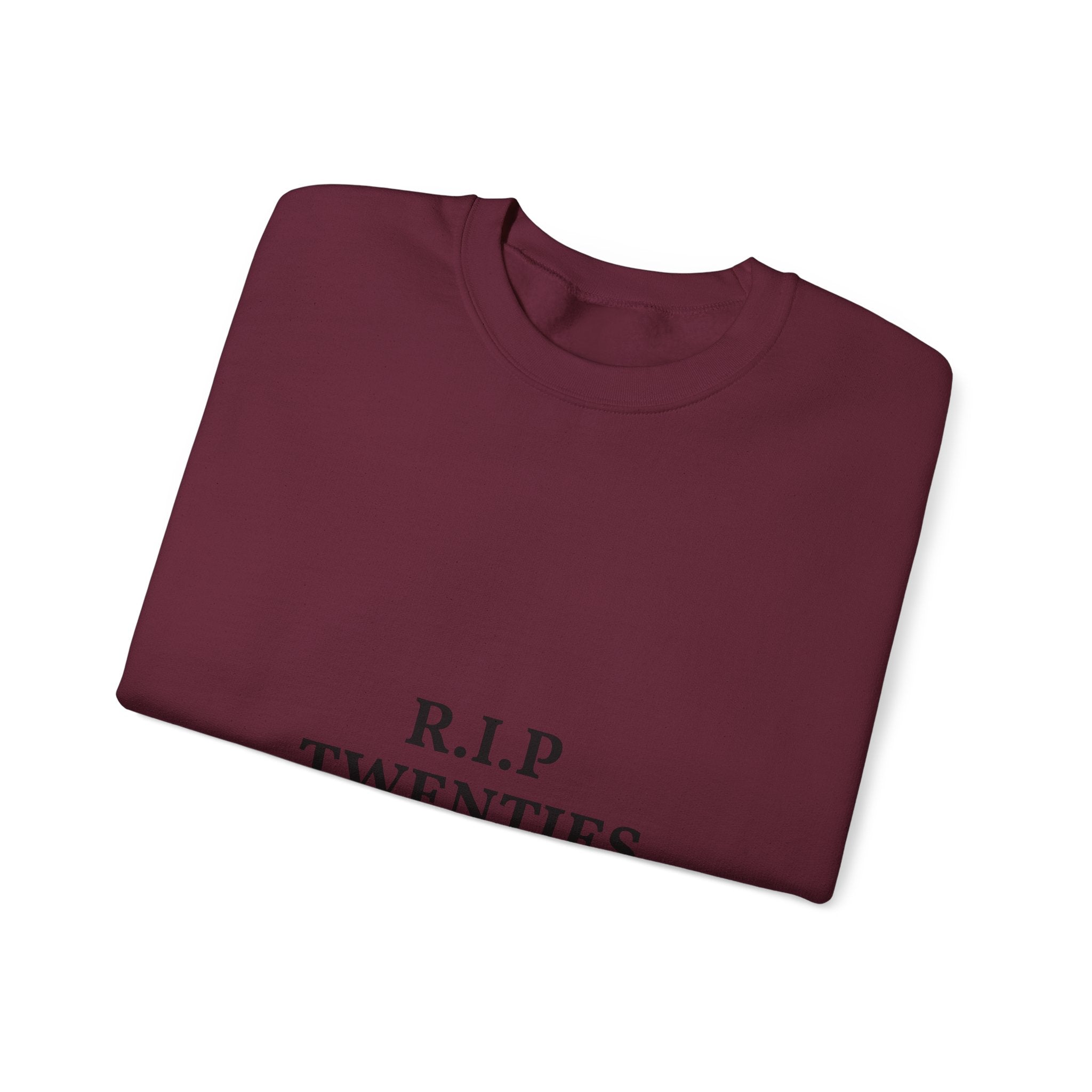 Folded black sweatshirt with 'Perfectly Imperfect' text on a white background