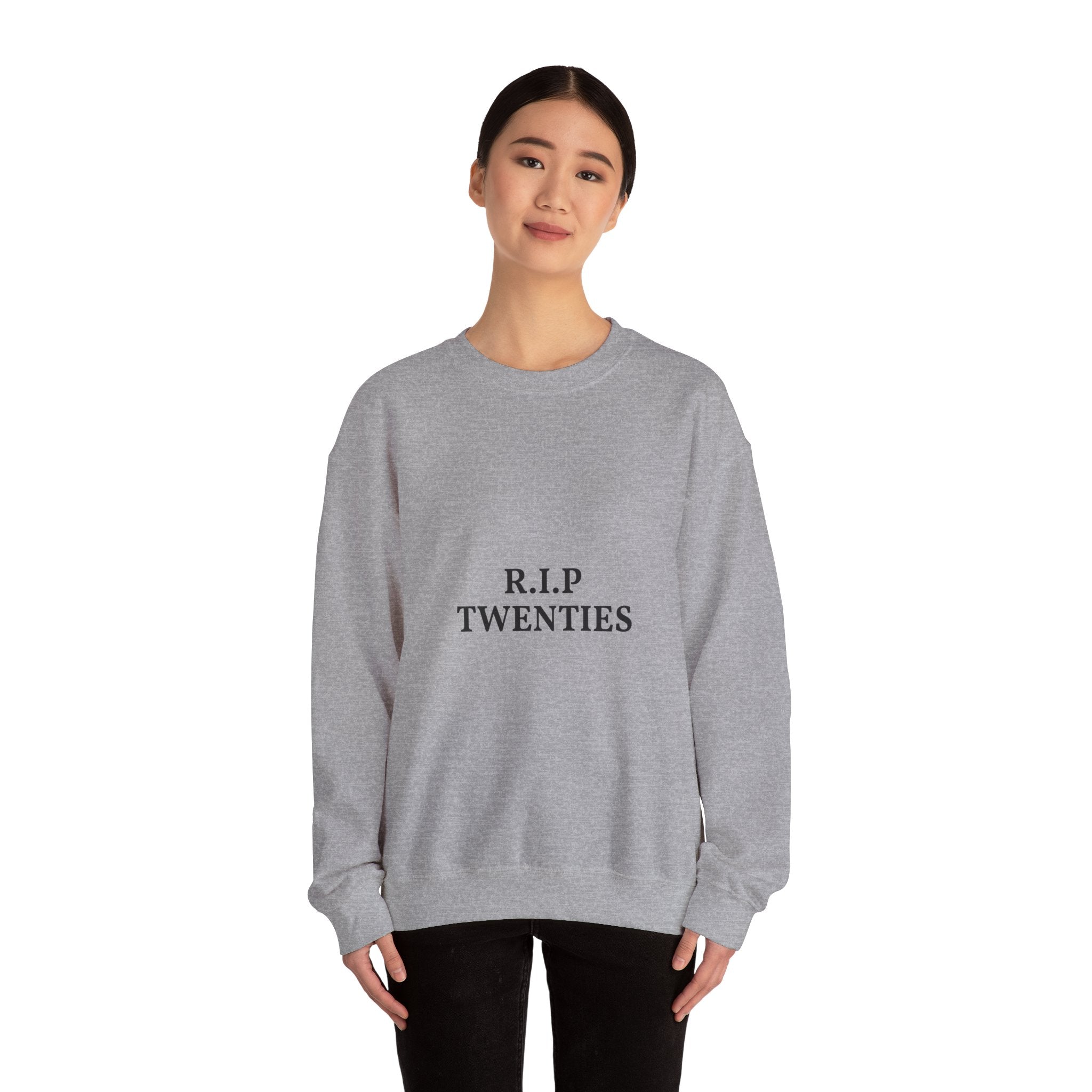 Person wearing a gray sweatshirt with 'R.I.P. TWENTIES' text on a white background