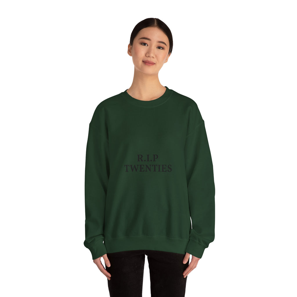 Person wearing a green sweatshirt with text on a white background