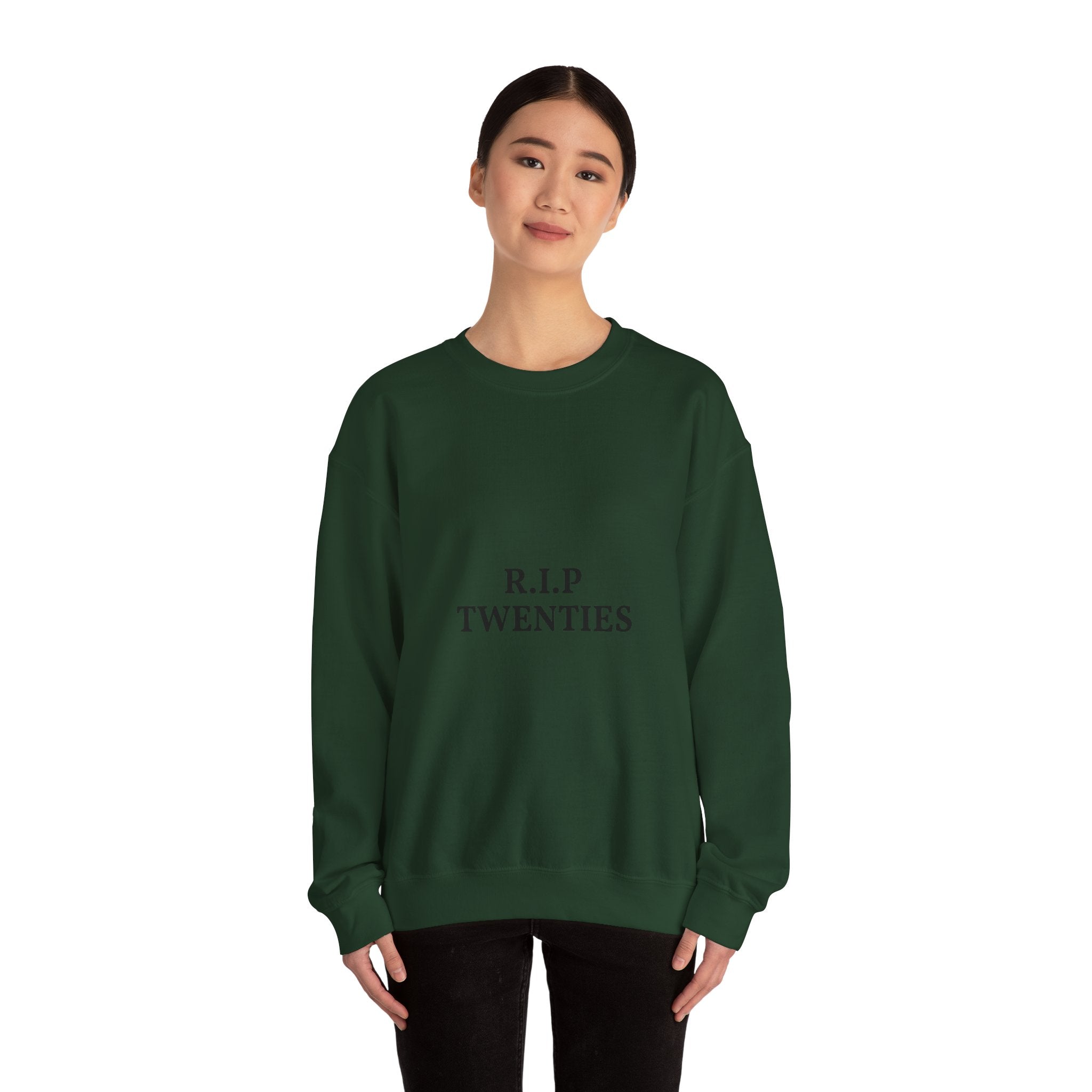 Person wearing a green sweatshirt with text on a white background