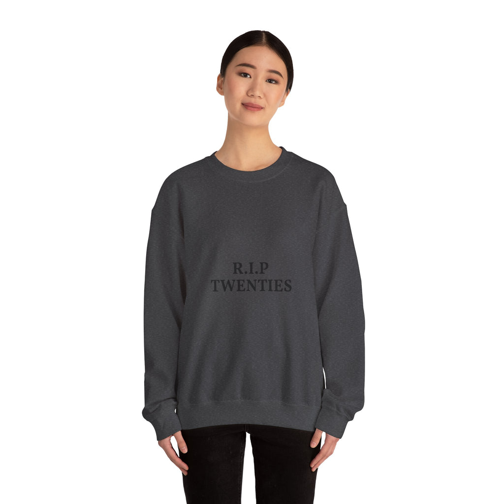 Person wearing a dark gray sweatshirt with 'R.I.P TWENTIES'  text on a white background