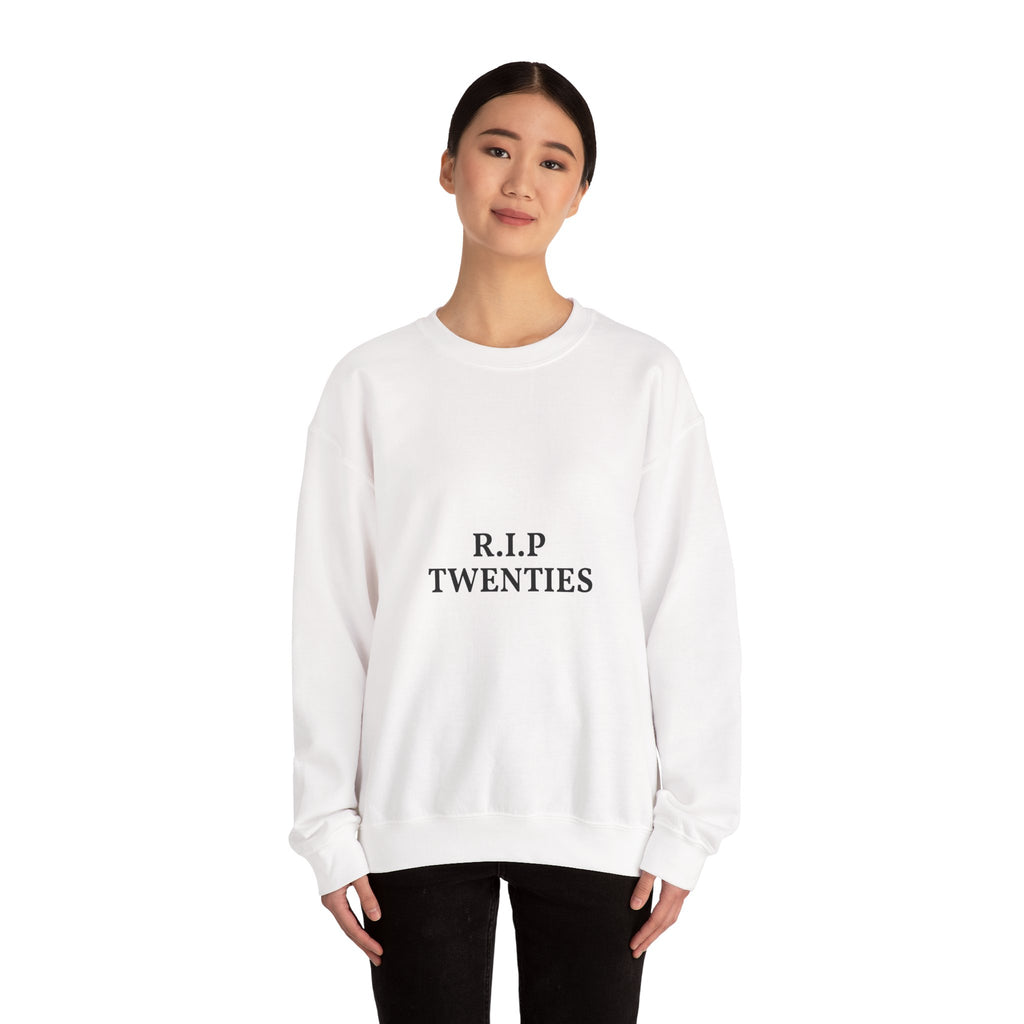 Person wearing a white sweatshirt with a light bulb and equation design on a white background