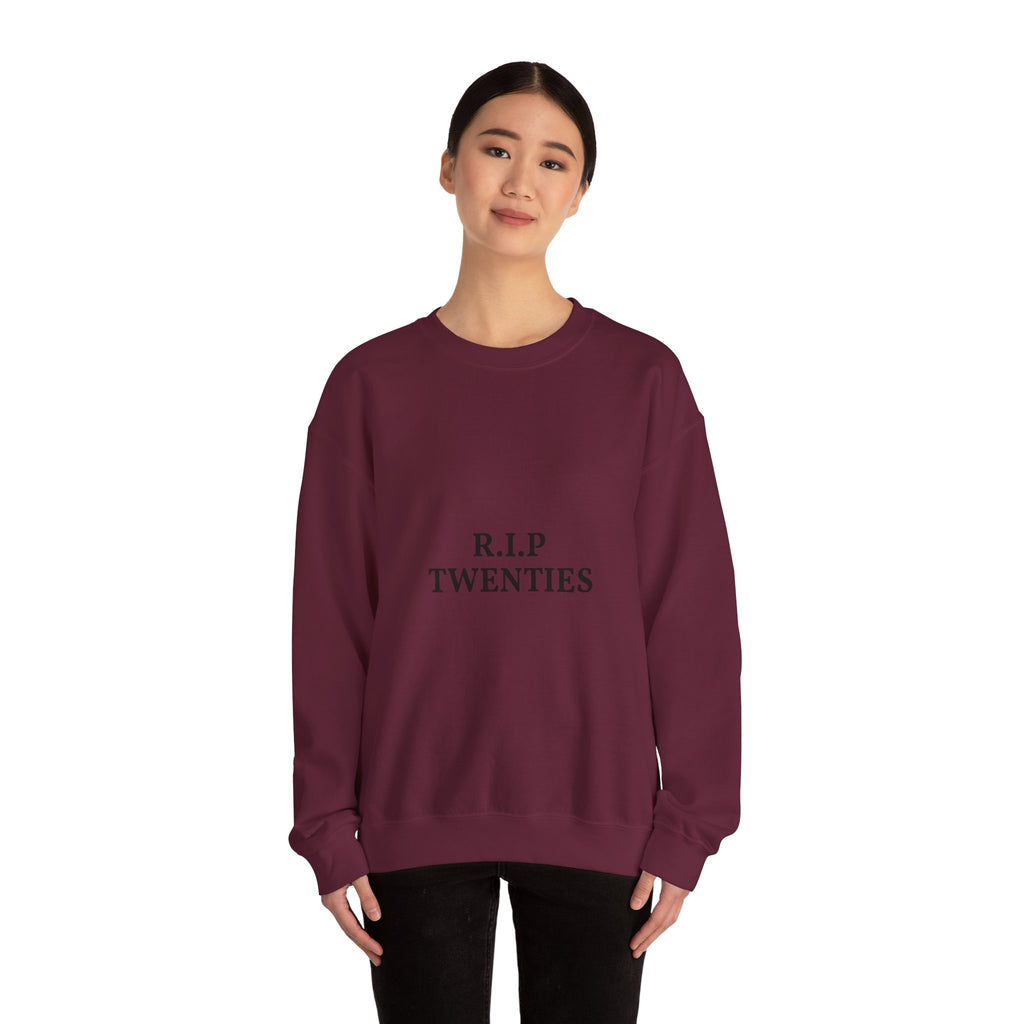 Maroon sweatshirt with text worn by a person on a white background